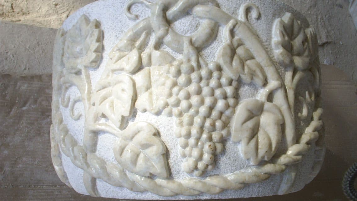 Detailed marble grape relief craftsmanship
